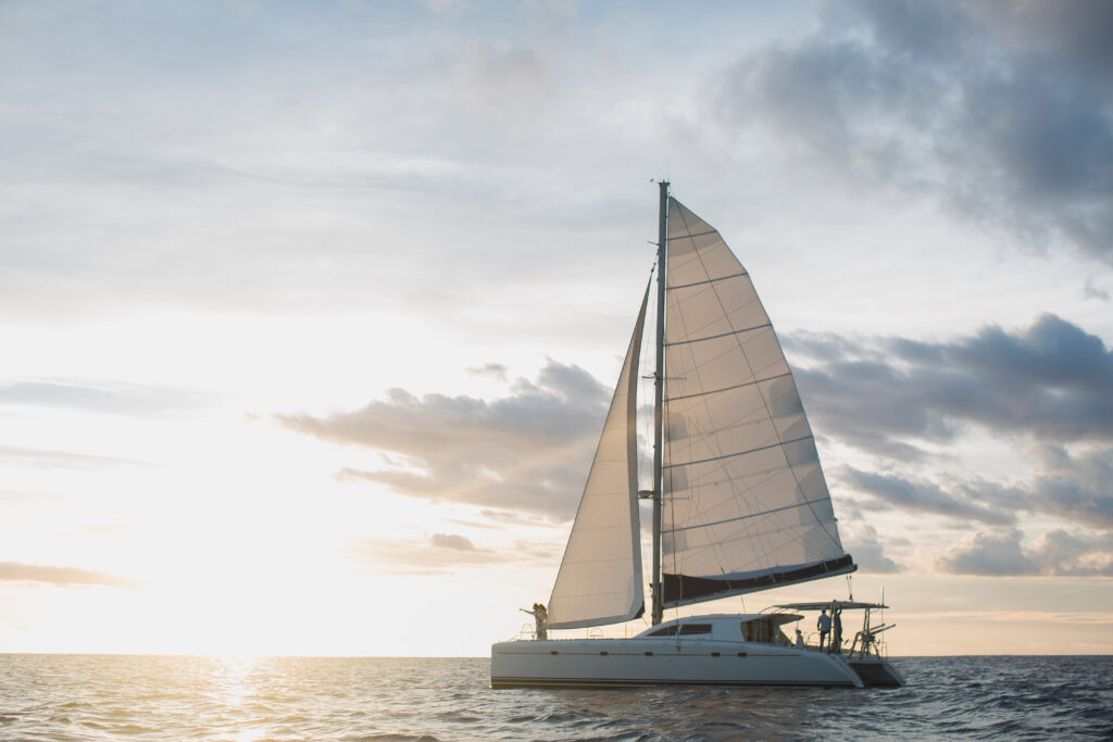 Wedding couple is hugging on a yacht. Beauty bride with groom.