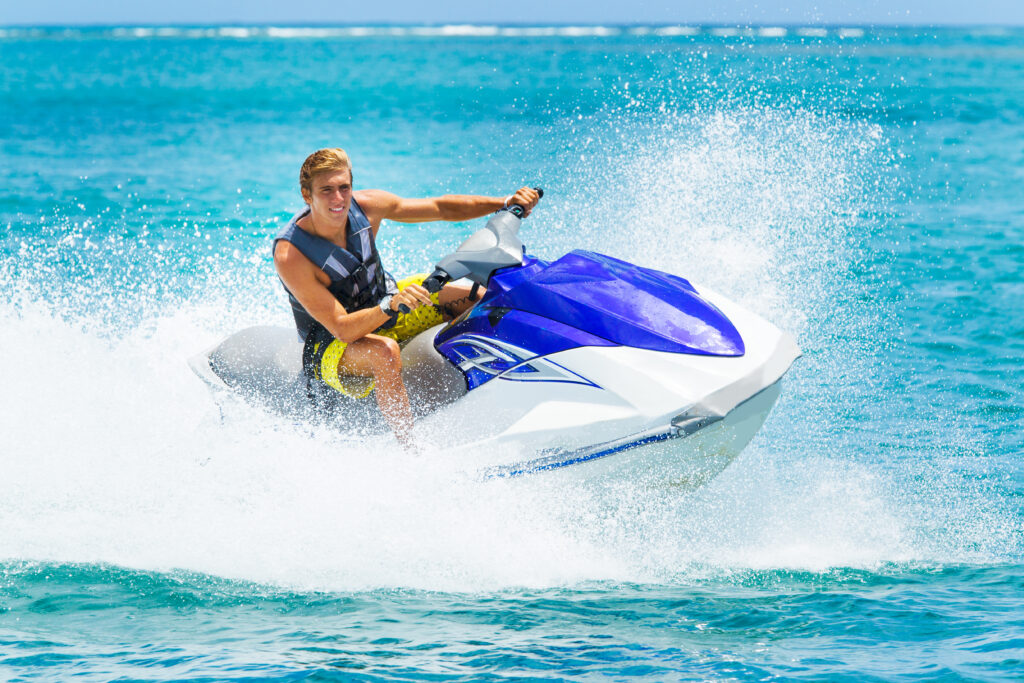 Young Man on Jet Ski, Tropical Ocean, Vacation Concept